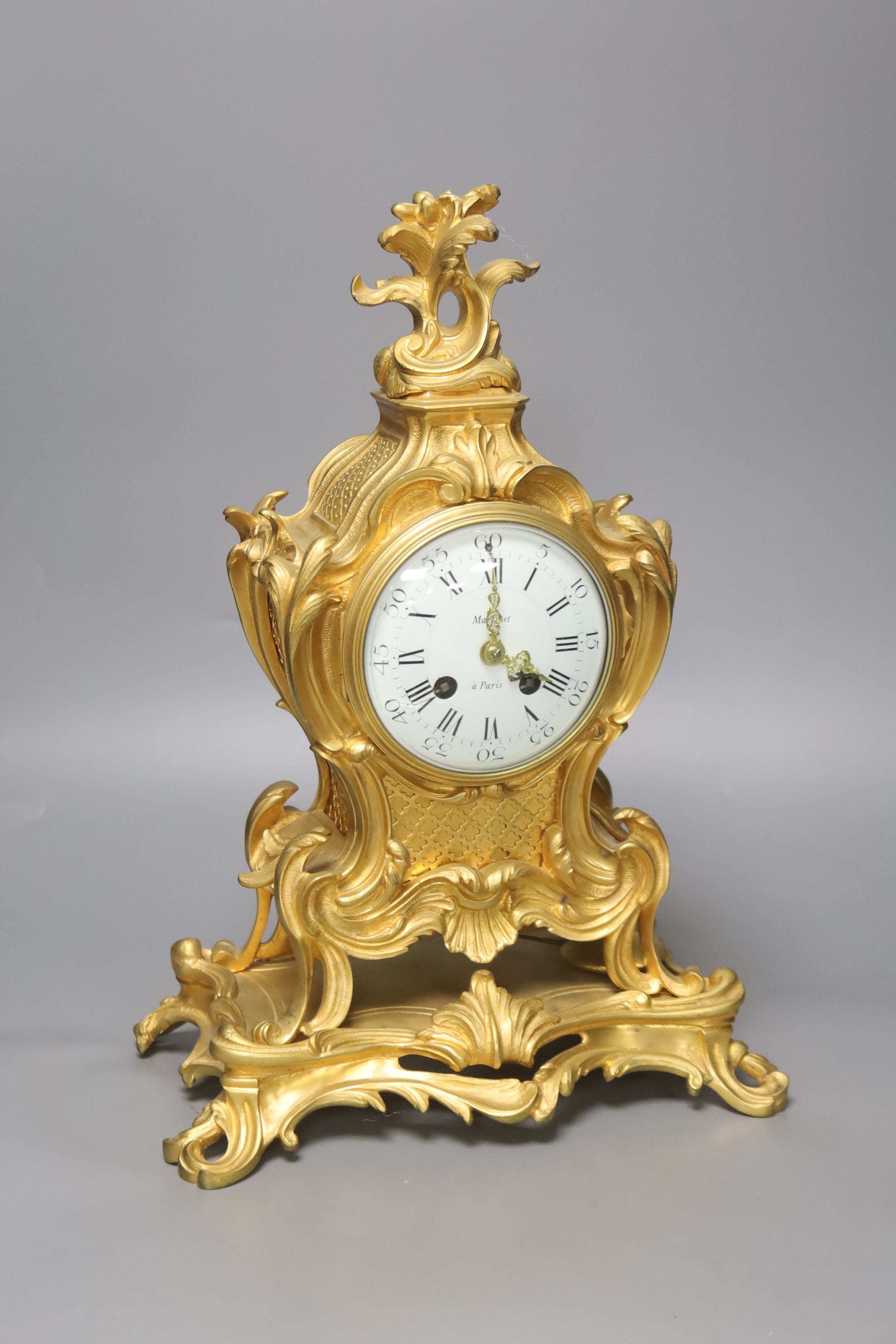 A late 19th-century French rococo revival gilt mantel clock, 40cm high